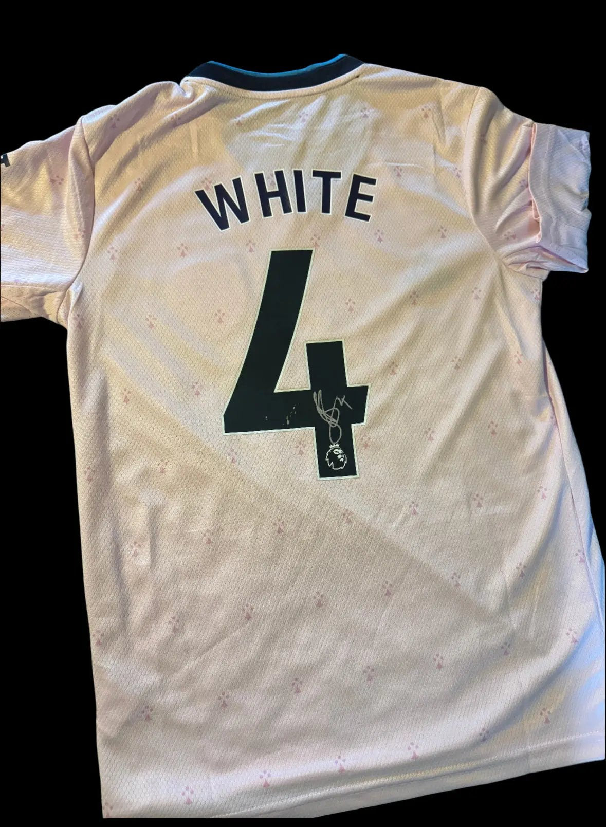 Authentic Arsenal 2021/22 third shirt with the iconic blue lightning design, hand-signed by Ben White on the reverse, with a Limelight Memorabilia COA. Close-up images show minor wear at the bottom hem.