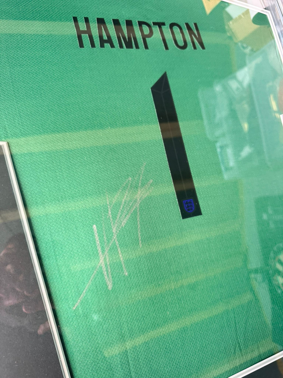 Close-up of Hannah Hampton’s authentic hand-signed autograph on an England Women’s Euro 2025 jersey.