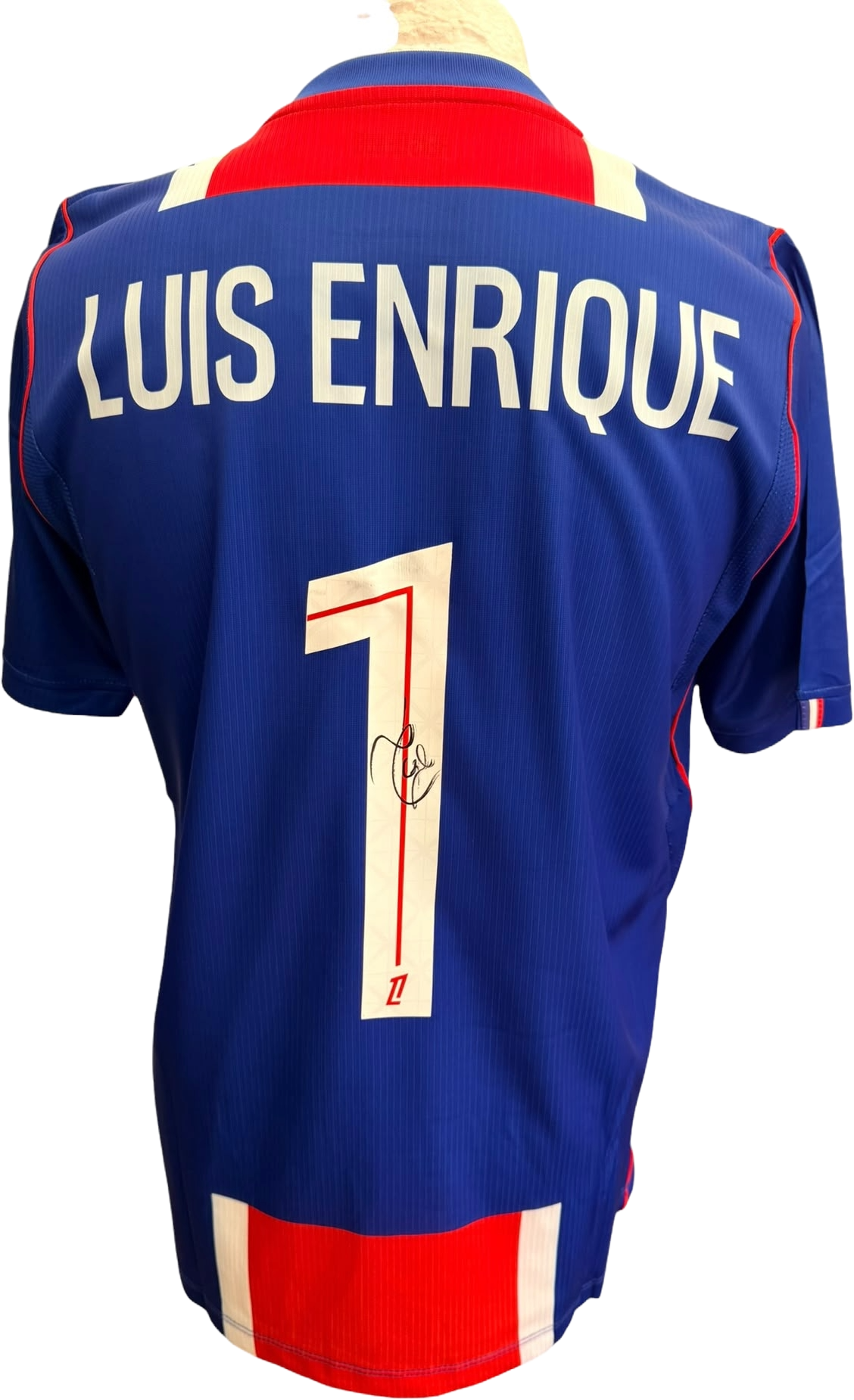 Authentic hand-signed signature by manager Luis Enrique on the back number of a PSG 2026/27 home shirt.