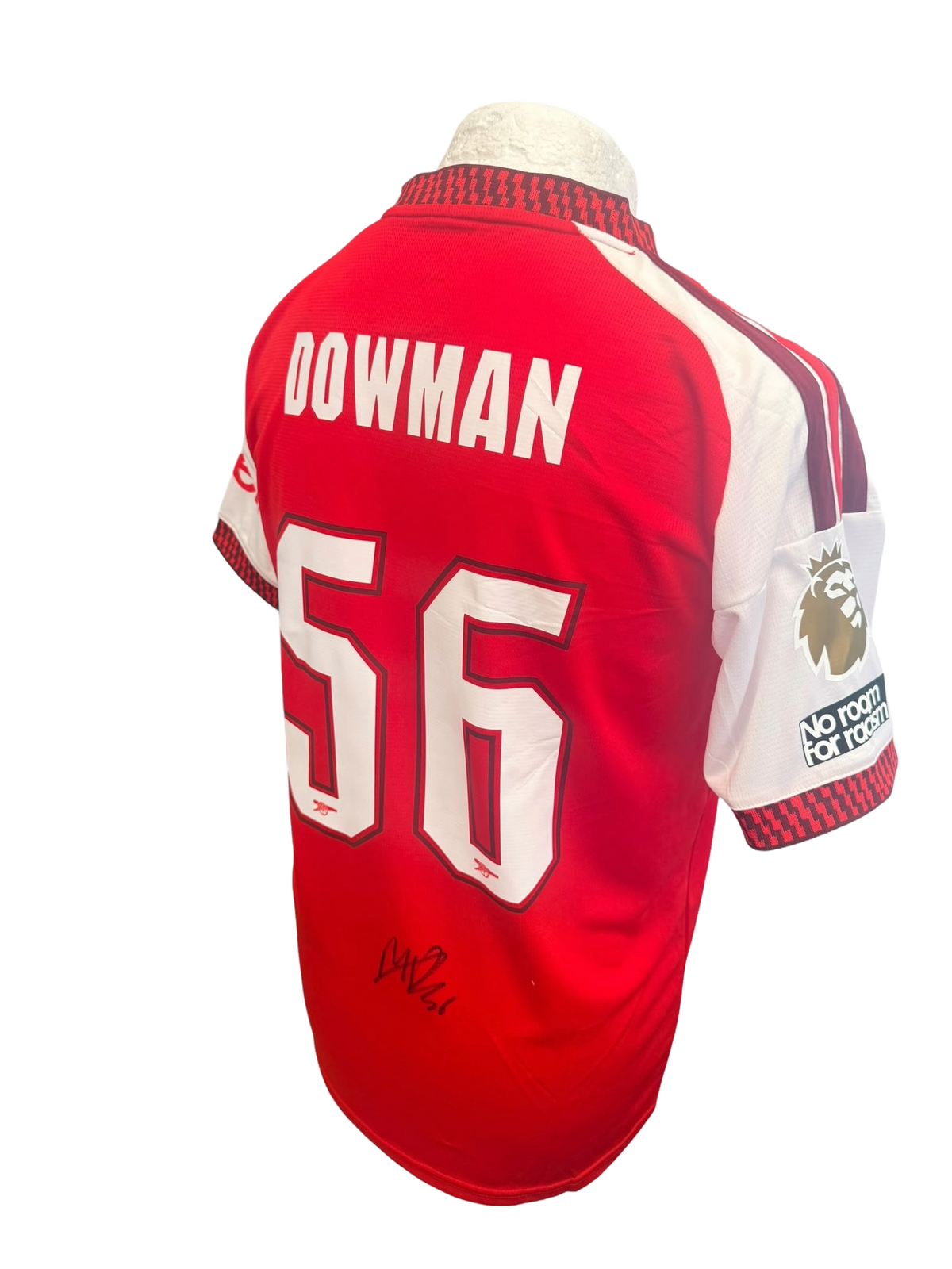 Angled view of the 2026/27 Arsenal home shirt sleeve showcasing the gold Premier League champions badge.