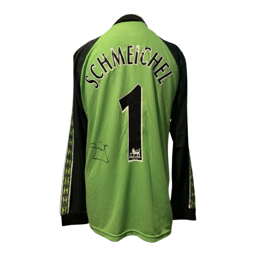 Authentic hand-signed Peter Schmeichel Manchester United 1999 Treble Winners goalkeeper shirt with bold signature.