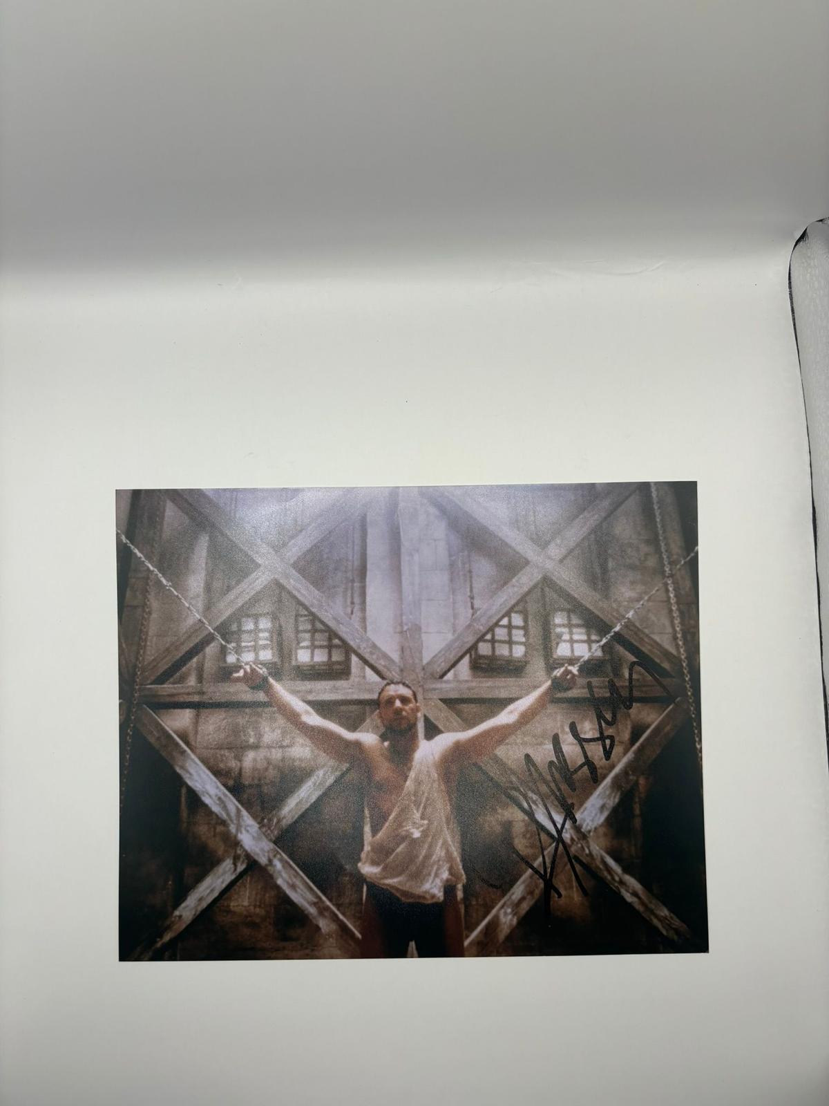Authentic hand-signed photo of Russell Crowe as Maximus Decimus Meridius in the movie Gladiator, signed in bold silver ink with a Limelight Memorabilia COA.