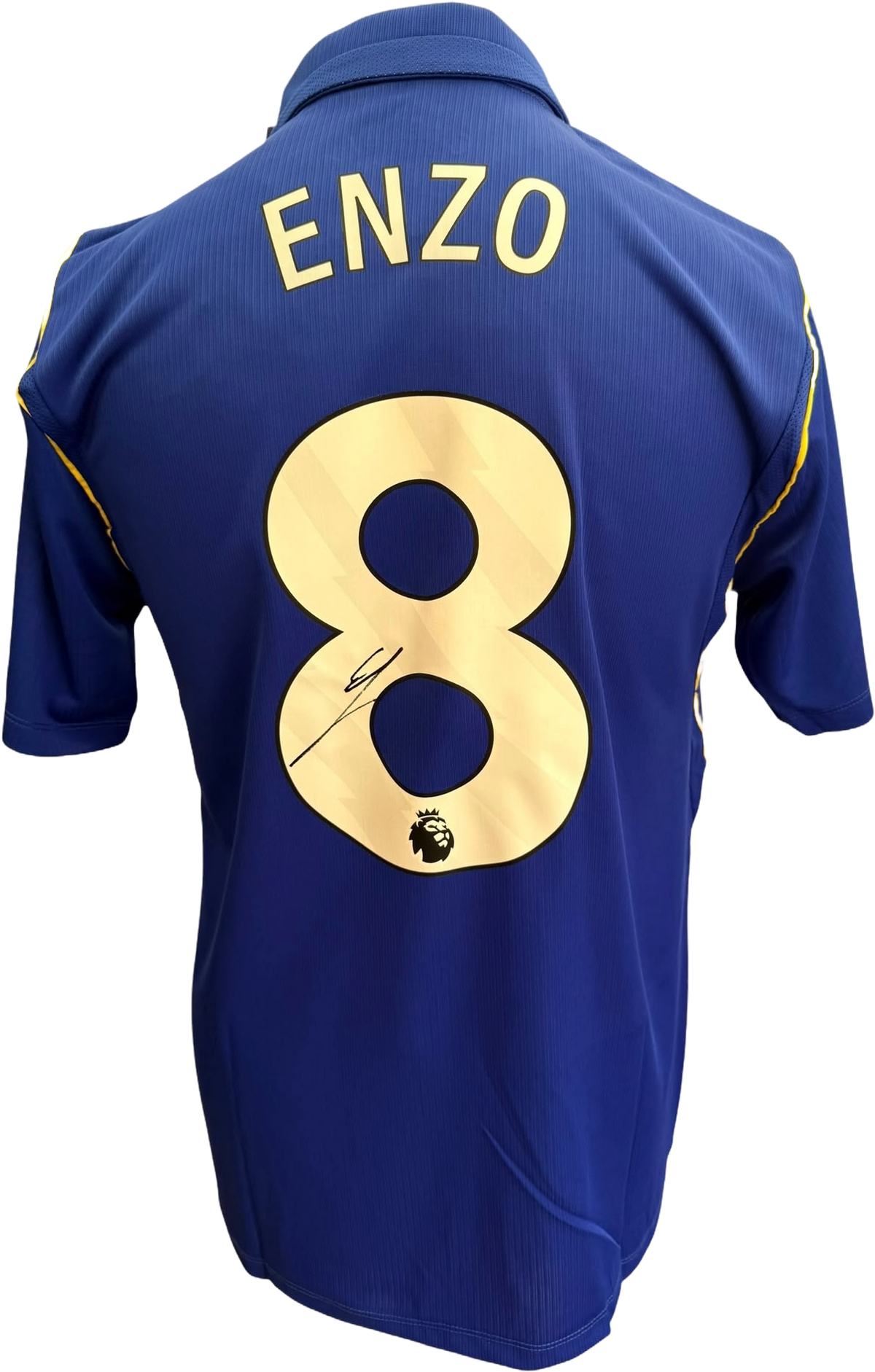 Close up photo of an authentic hand-signed autograph by Enzo Fernandez on the front of the blue Chelsea 2026/27 home shirt.