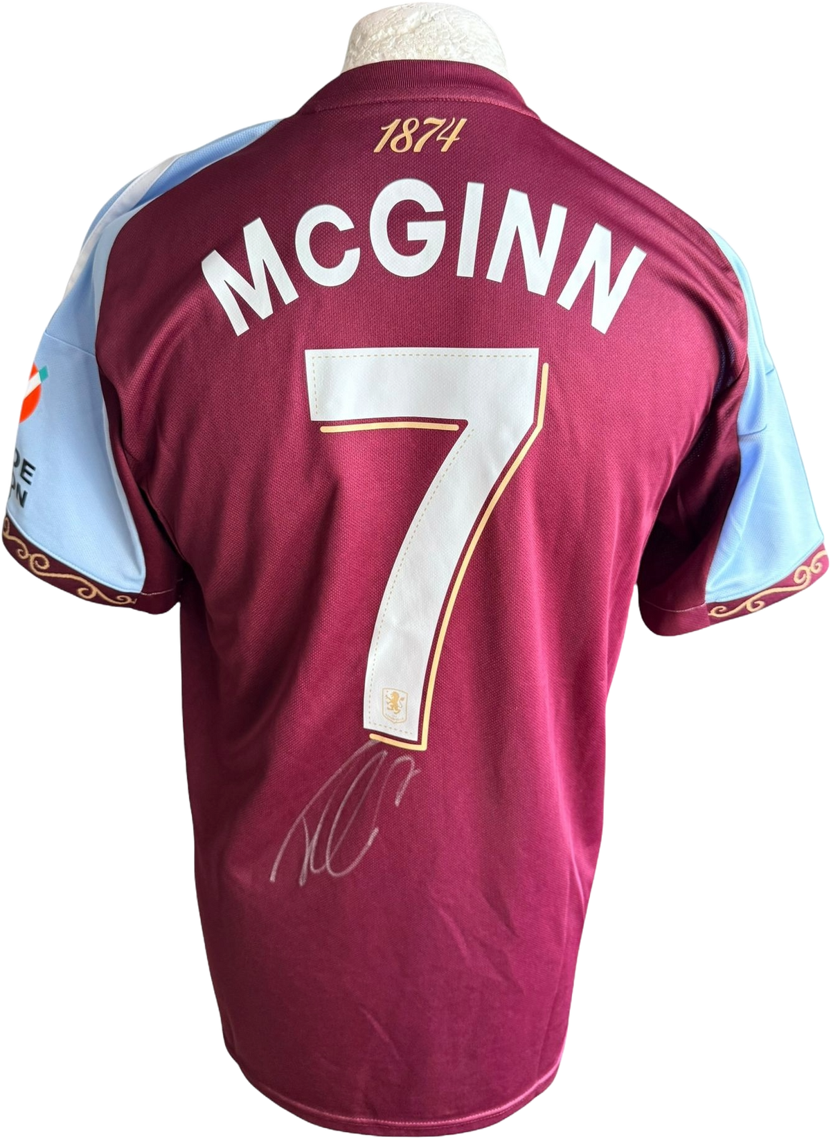 Authentic hand-signed John McGinn Aston Villa home jersey from the 2025/26 season featuring a clear signature on the back.