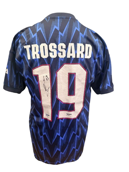 Hand-signed Leandro Trossard Arsenal 2025/2026 away shirt showing the clear authentic autograph on the back of the jersey with official club font.