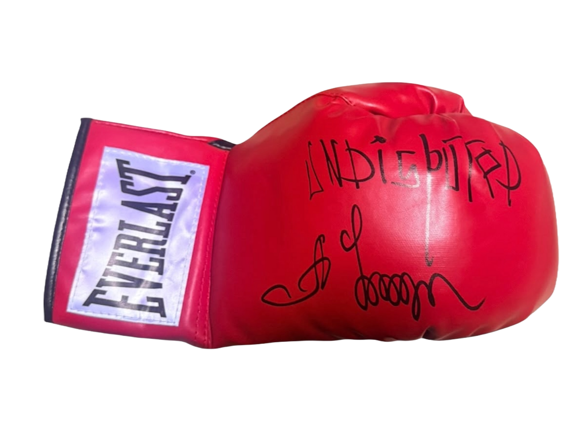 Detailed view of the signed Oleksandr Usyk undisputed glove featuring a large hand-signed autograph and Undisputed inscription on the main striking surface