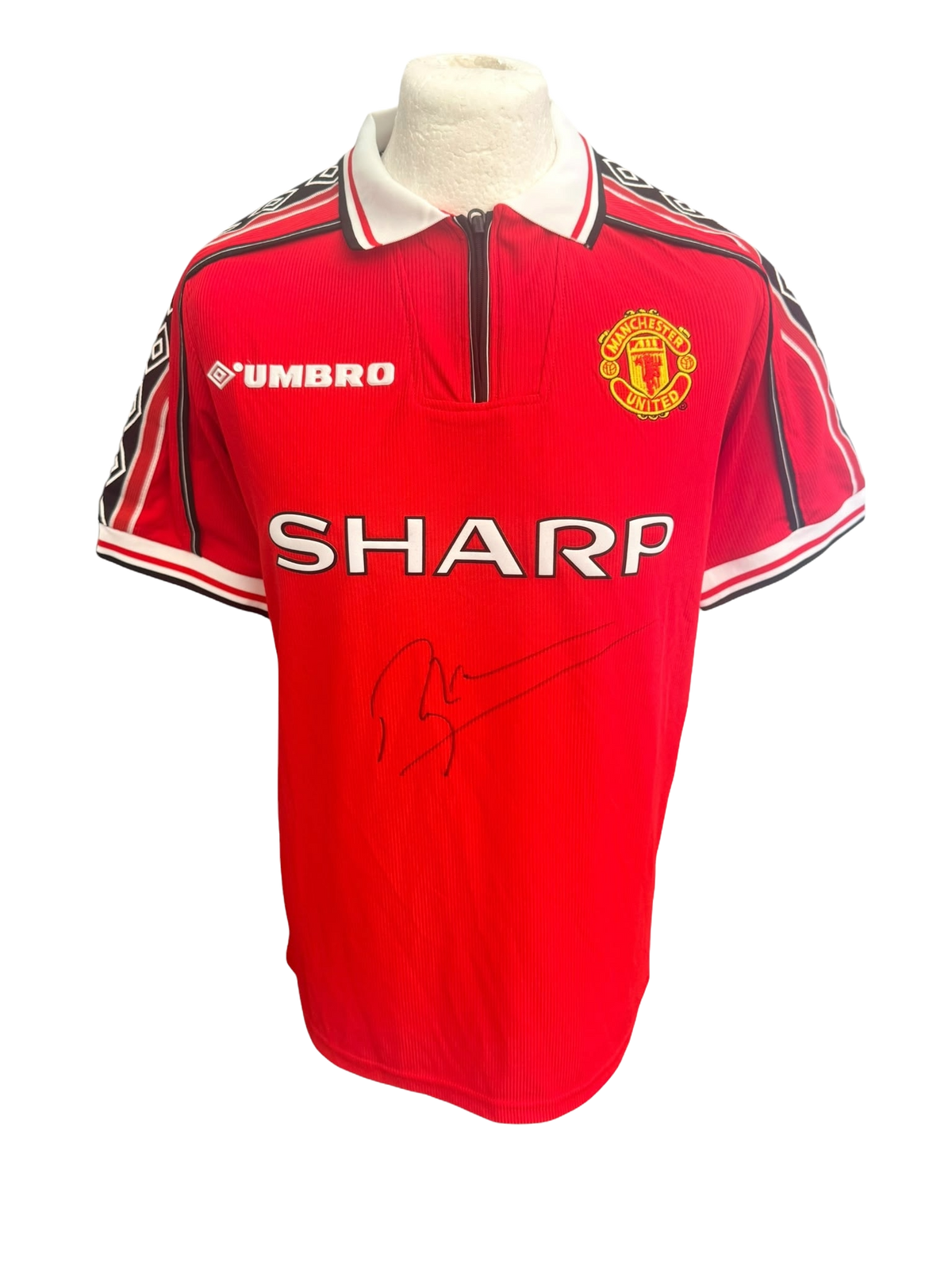 Front view of a red 1998/99 Manchester United home shirt featuring a large signature in black permanent marker by Roy Keane.