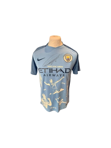 Custom sky blue Manchester City shirt hand-signed by Vincent Kompany, featuring bespoke trophy embroidery and match details.