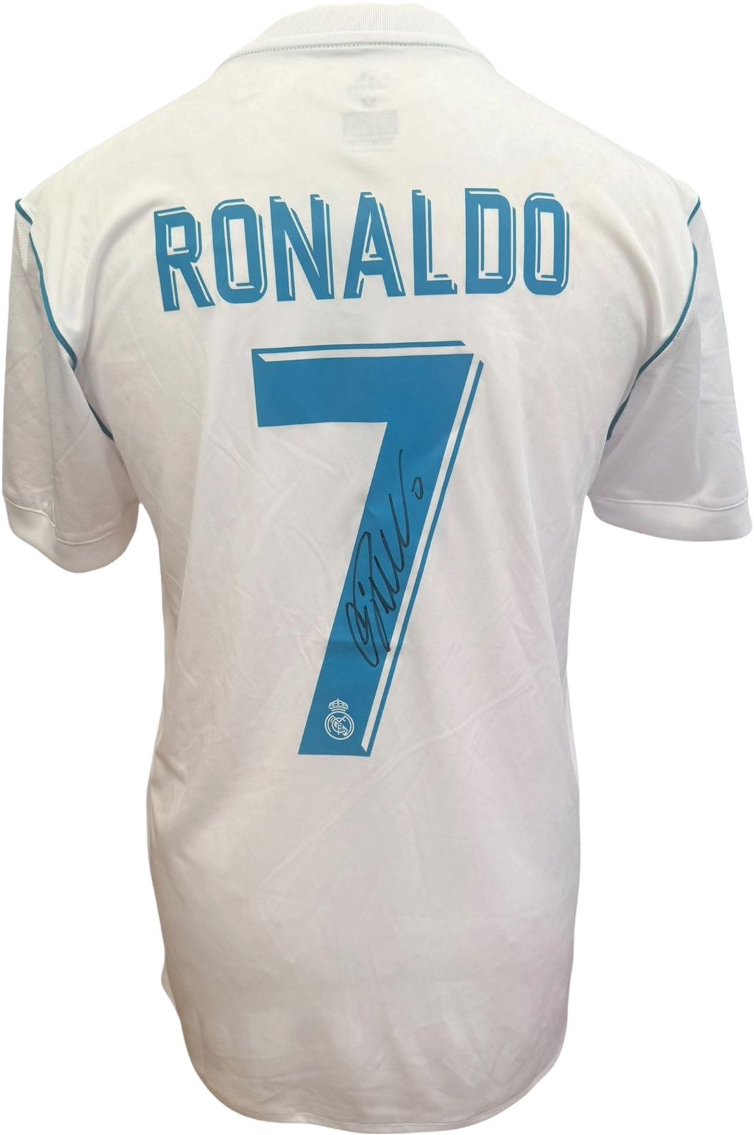 Framed signed football shirts featuring modern and retro designs on display.