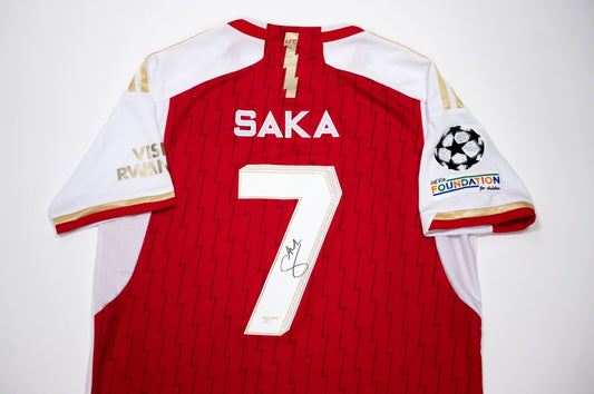 Framed and signed Bukayo Saka Arsenal football shirt memorabilia, ready for collection.