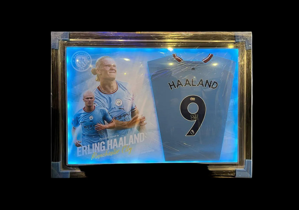 ERLING HAALAND SIGNED AND FRAMED MANCHESTER CITY HOME SHIRT
