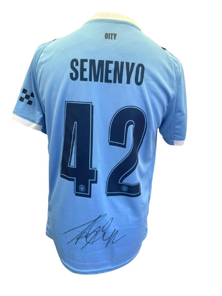 Hand-signed Antoine Semenyo Manchester City 25/26 home shirt showing the large authentic autograph on the back sky-blue jersey with official club font.