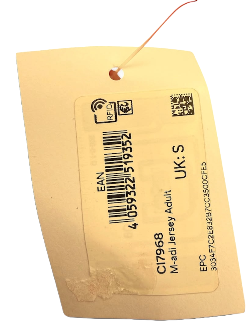Close up view of the attached Adidas product tag with unique manufacturing product ID code