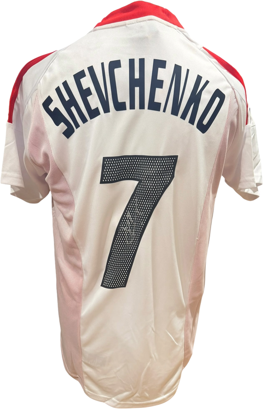 Rear view of a replica 2002/03 AC Milan home shirt hand-signed by striker Andriy Shevchenko, displayed alongside the Certificate of Authenticity.