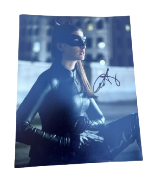 Dynamic action still of Anne Hathaway as Catwoman in The Dark Knight Rises, hand-signed in bold permanent ink.