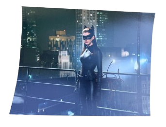 High-definition cinematic photo of Anne Hathaway as Catwoman, hand-signed in bold permanent