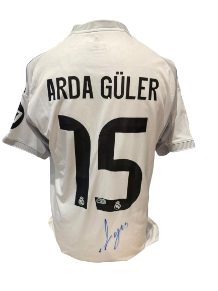 Official Real Madrid home shirt hand-signed by midfielder Arda Güler in bold permanent ink.