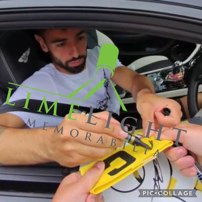 Photo proof of Bruno Fernandes hand-signing the Manchester United captain's armband for Limelight Memorabilia.