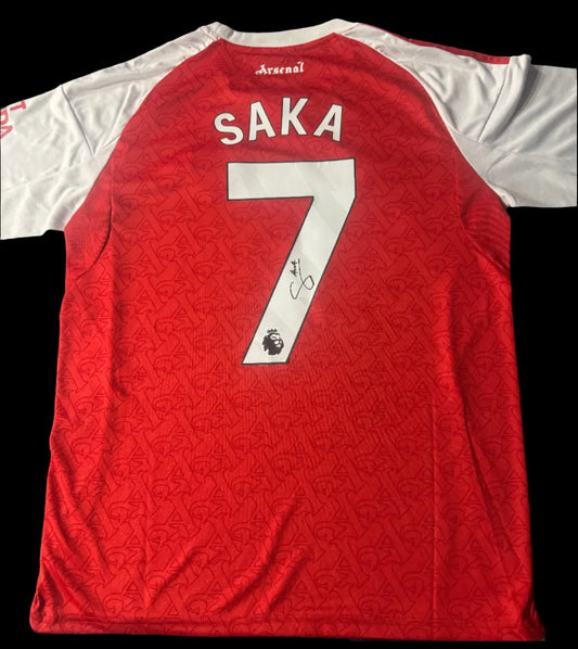 Authentic Arsenal 2025/26 home shirt hand-signed by Bukayo Saka on the reverse, featuring a bold signature and an official Limelight Memorabilia COA.