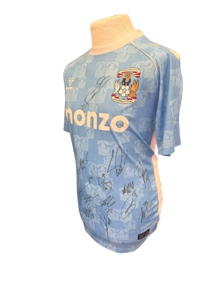 A side profile of the signed Coventry City shirt showcasing the clarity of the player autographs.