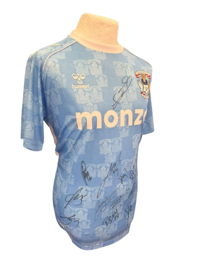 Detailed close-up of the signatures on the sky blue fabric of the 25/26 CCFC promotion kit.