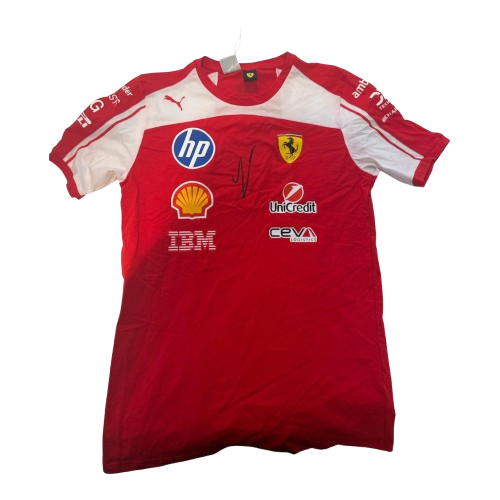 Authentic red Scuderia Ferrari team shirt hand-signed by Charles Leclerc in black permanent marker, featuring 2026 sponsors and a Certificate of Authenticity.
