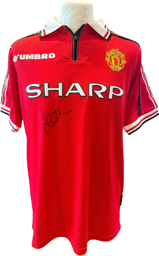 David Beckham autographed red 1999 treble winning Manchester United home shirt with zip up collar.