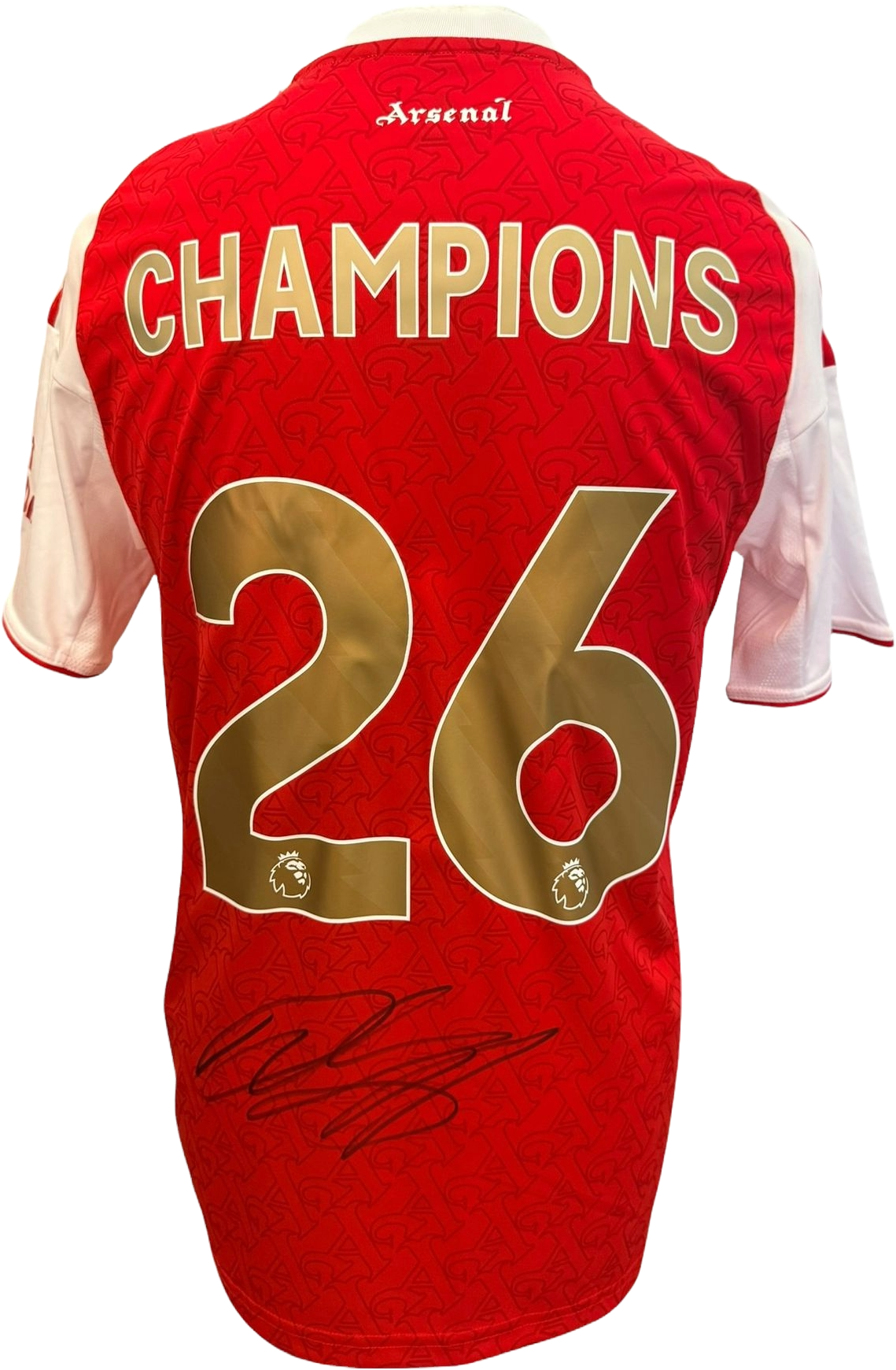 The reverse of the 2025/26 Arsenal home jersey showcasing the commemorative gold Champions printing and Declan Rice's hand-signed autograph on the fabric.