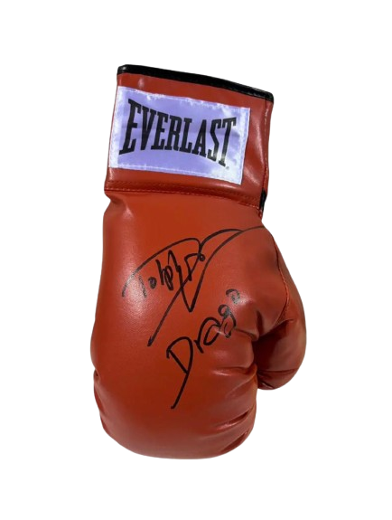 A hand-signed Dolph Lundgren Ivan Drago boxing glove in red and gold with a bold autograph.