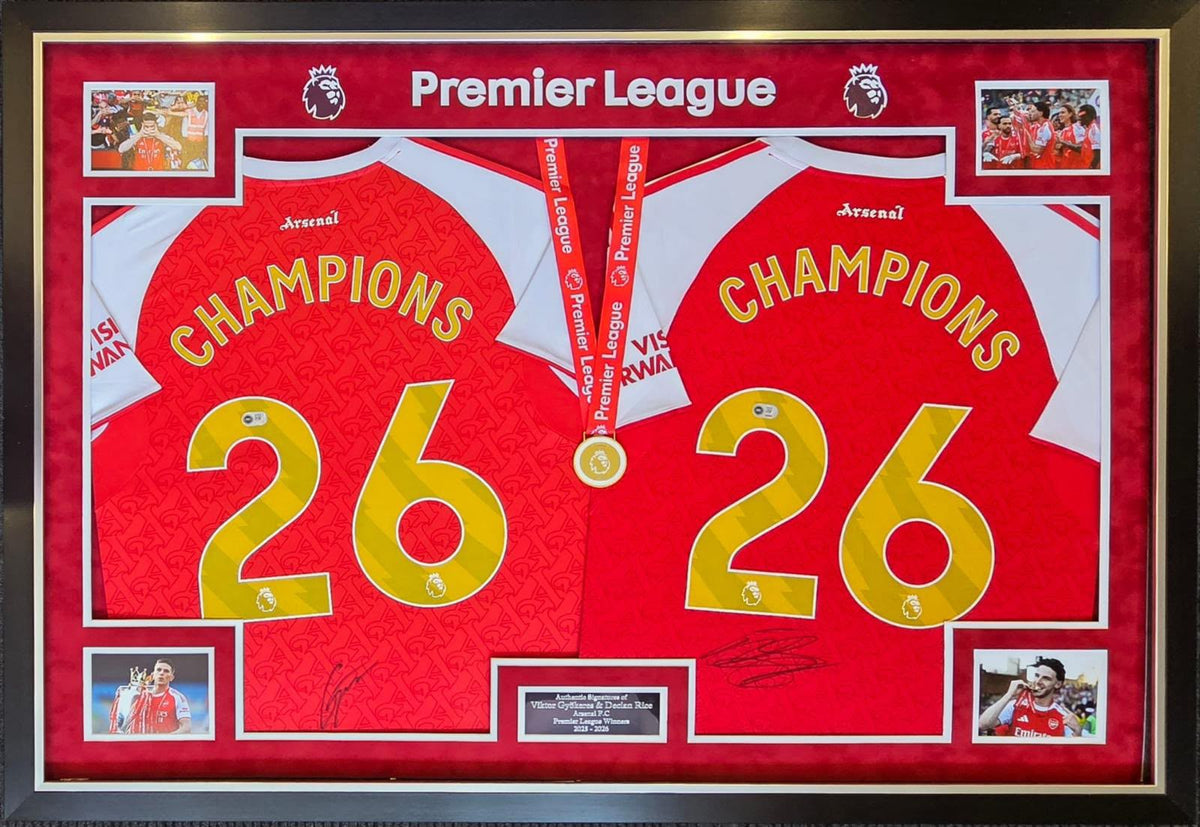Luxury framed display showcasing two hand-signed Arsenal shirts by Declan Rice and Viktor Gyokeres with gold Champions 26 lettering and a replica winners medal.