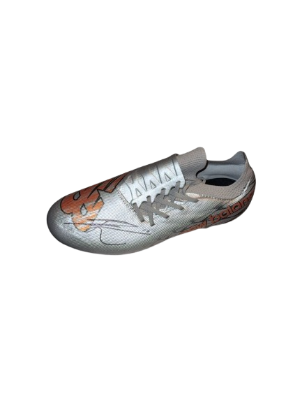 A single, authentic Eberechi Eze signed football boot, featuring a bold black ink autograph on a professional-grade New Balance boot.
