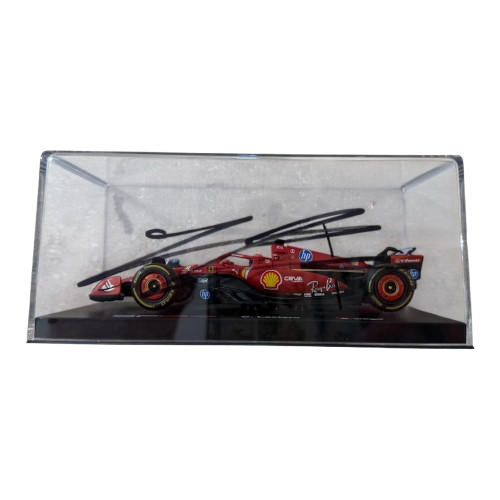 A detailed 1:43 scale Ferrari Formula 1 car hand-signed by Charles Leclerc, housed in a premium clear acrylic display box with a Certificate of Authenticity.