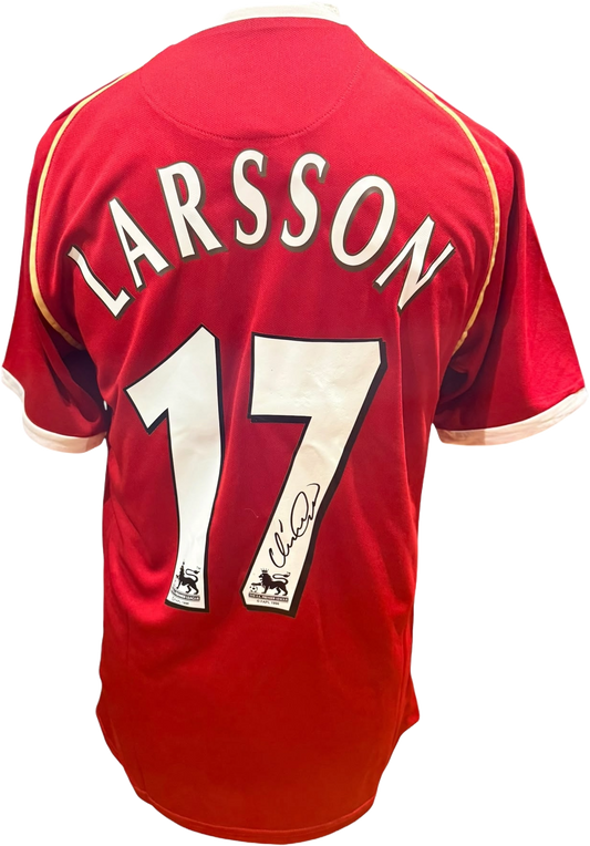 Rear view of a retro replica Manchester United home shirt hand-signed by striker Henrik Larsson, displayed alongside the Certificate of Authenticity.