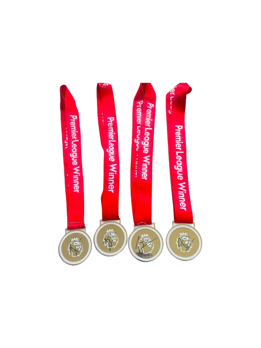 Front view of a replica Premier League winners medal with red ribbon, hand-signed on the front by Arsenal defender Jurrien Timber, displayed alongside the Certificate of Authenticity.