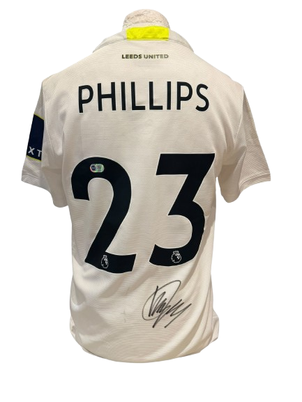 Official Leeds United home shirt hand-signed by Kalvin Phillips in bold permanent ink.
