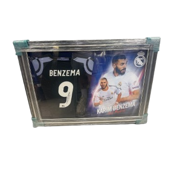 A professionally framed Karim Benzema signed Real Madrid away shirt with custom mounts and a plaque.