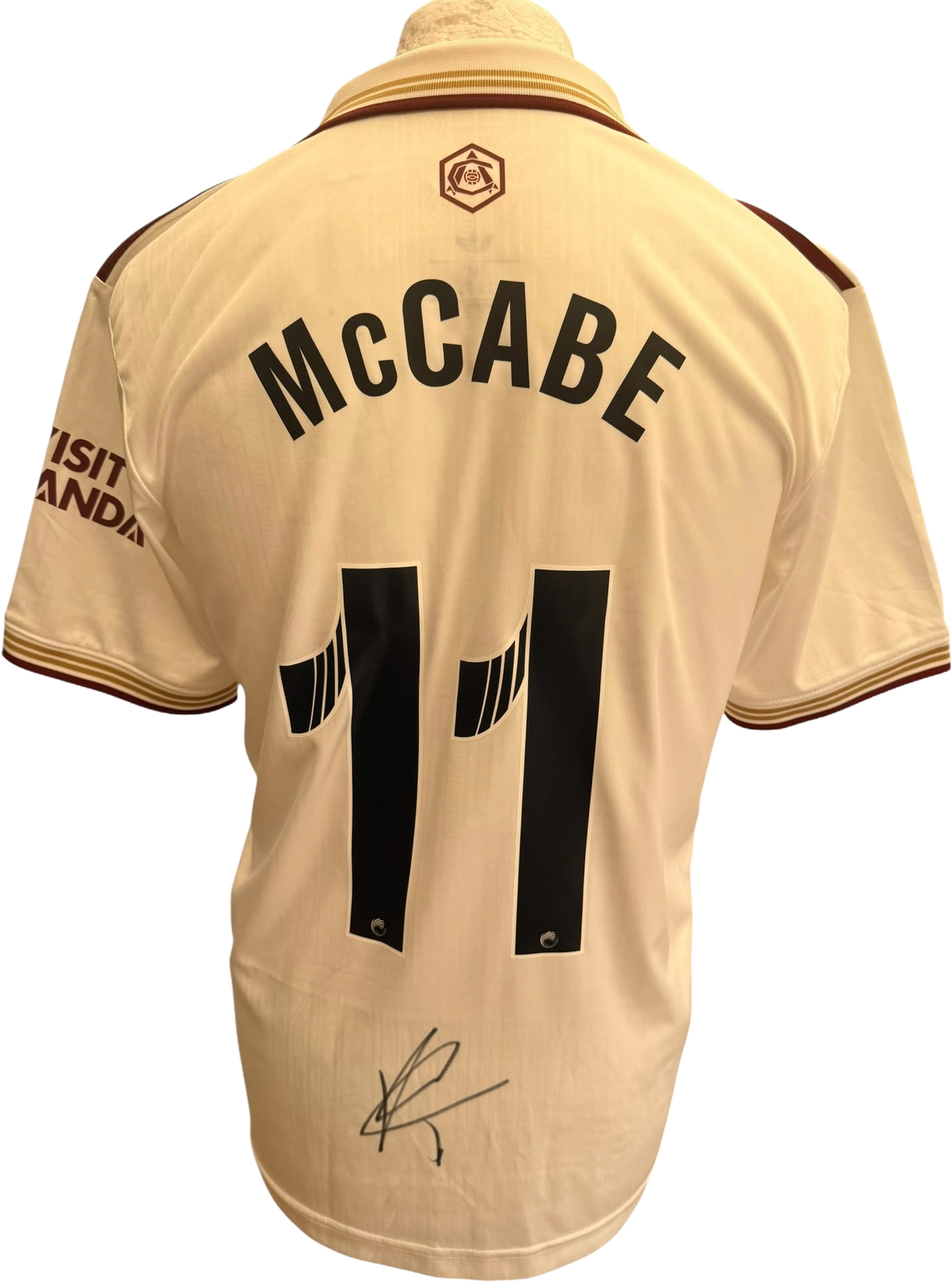 Authentic hand-signed autograph by Katie McCabe across the front of the green and black Arsenal Women 2025/26 third shirt.
