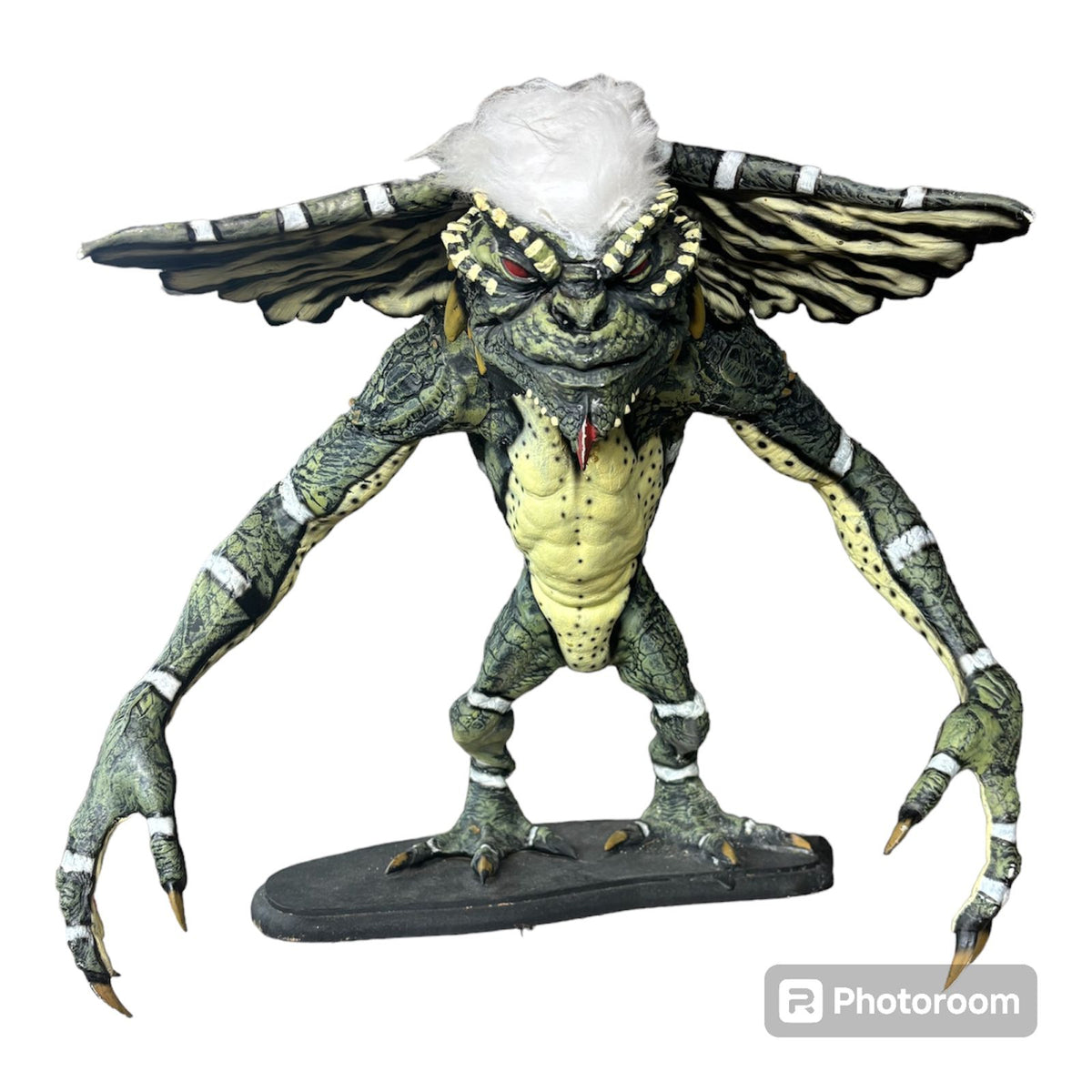 A movie-accurate, life-sized 1:1 scale statue of a mischievous Gremlin, featuring realistic skin texture, hand-painted details, and standing at full cinematic height.