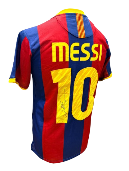 An angled shot of the reverse of a Lionel Messi signed Barcelona shirt showing the authentic signature and 2010/11 details.