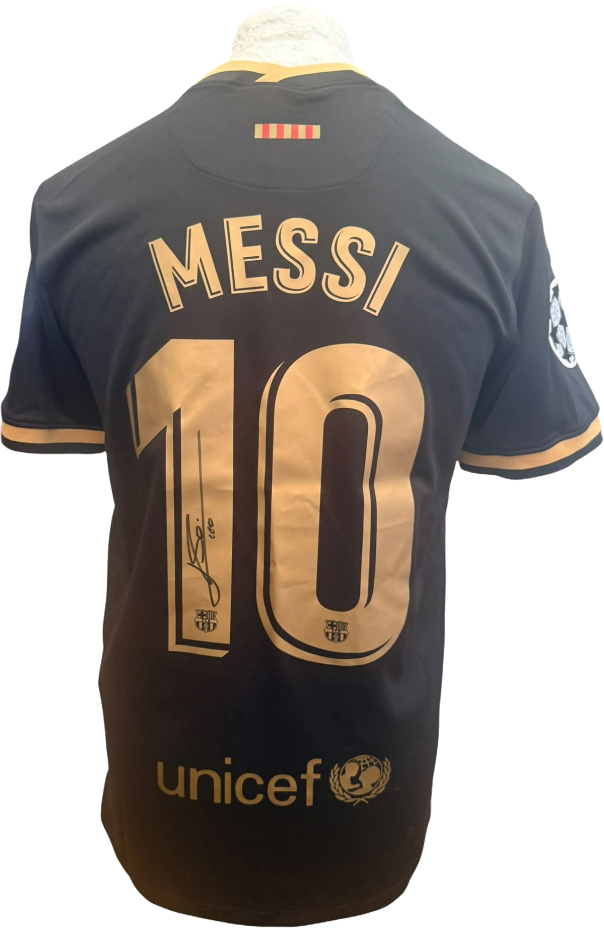 Back view of the Lionel Messi signed Barcelona black away shirt showcasing the bold autograph.