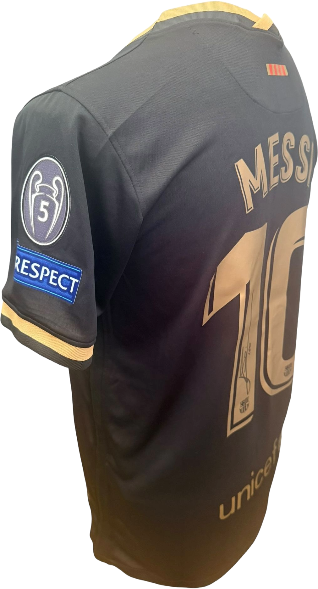 Close-up side view of the Barcelona black away shirt highlighting the Champions League multiple winners sleeve badge detail and the champions leageu respect sleeve badge