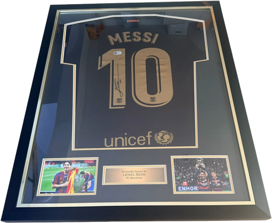Lionel Messi hand-signed black Barcelona away shirt presented in a premium black display frame with a silver plaque.