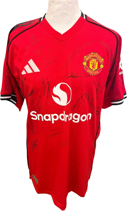 Front view of the authentic player version Manchester United 2025/26 home shirt featuring multiple player signatures in dark ink.