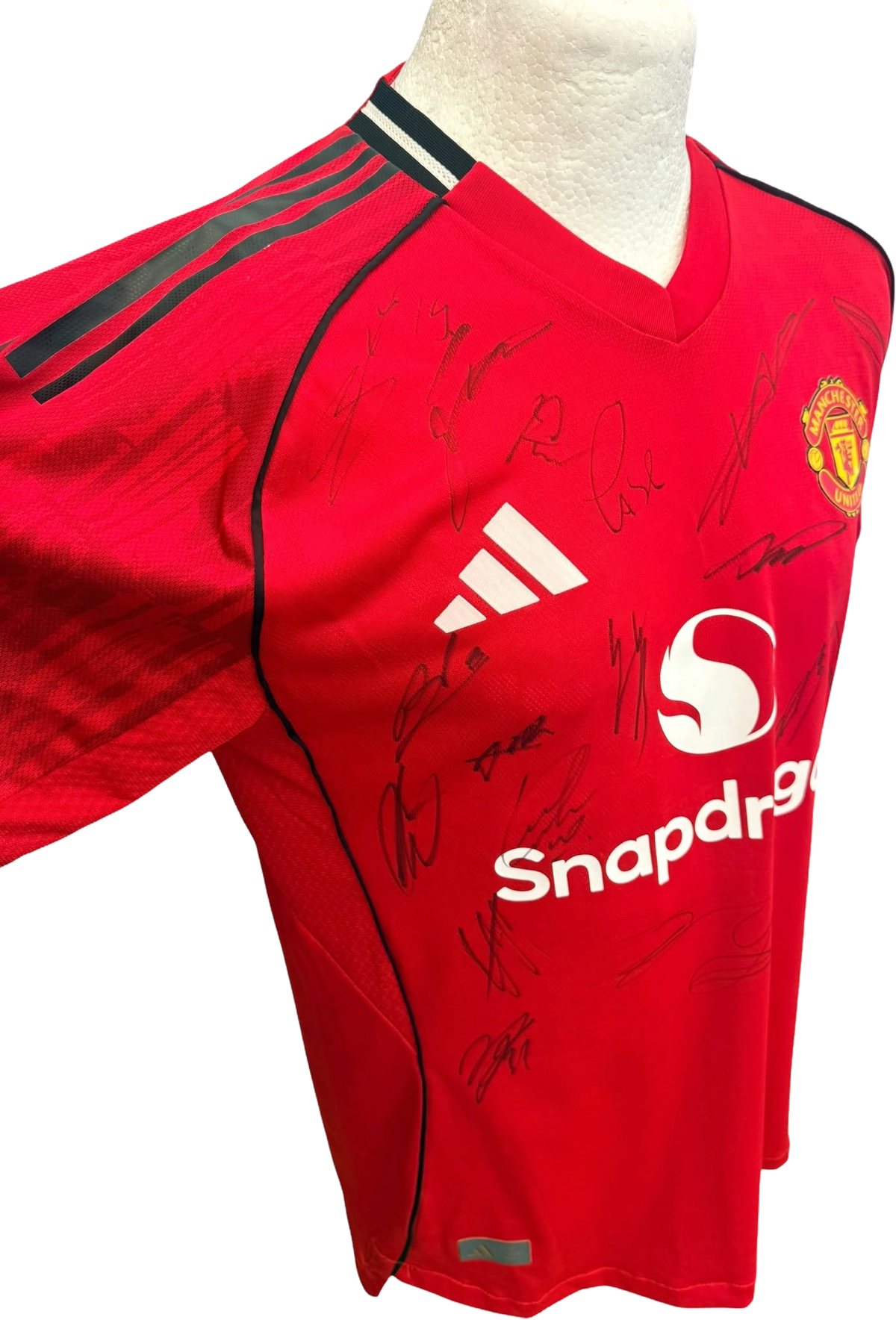 Left side view of the authentic player version Manchester United 2025/26 home shirt showing high-performance ventilation panelling and player autographs.