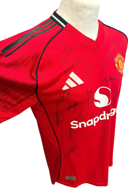 Left side view of the authentic player version Manchester United 2025/26 home shirt showing high-performance ventilation panelling and player autographs.