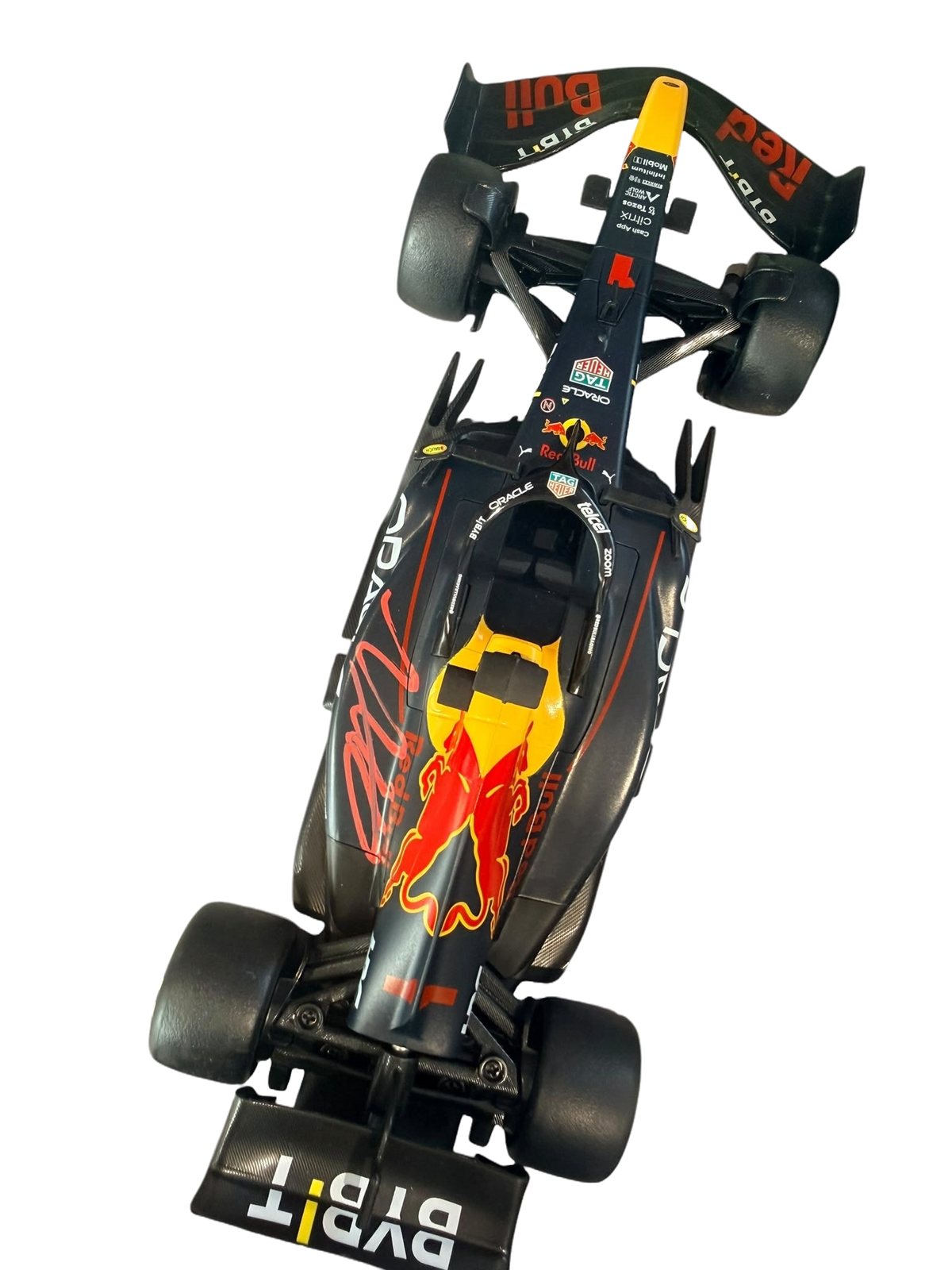 Top-down view of a working remote control Red Bull F1 car hand-signed on the bodywork by Max Verstappen.