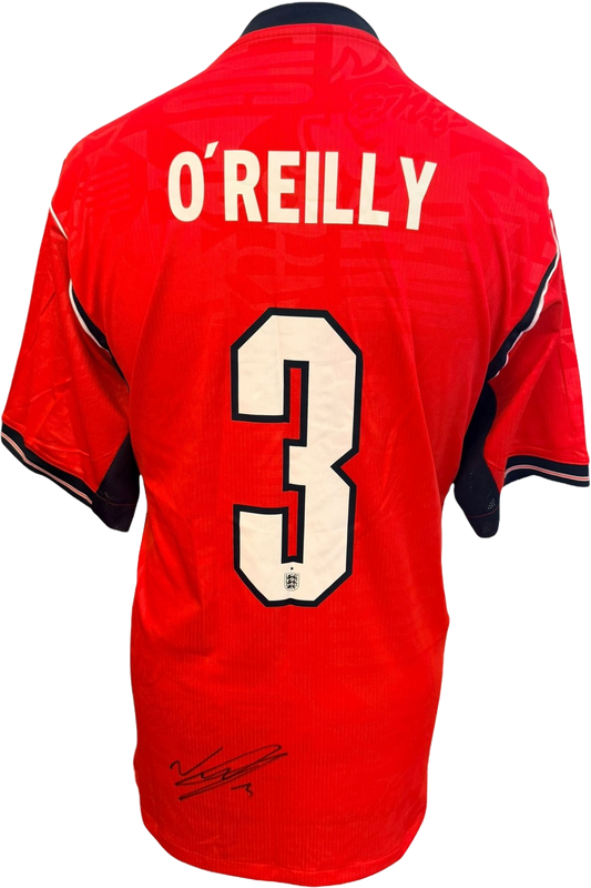Authentic hand-signed Nico O'Reilly England World Cup away shirt featuring a crisp signature on the front of the national jersey.