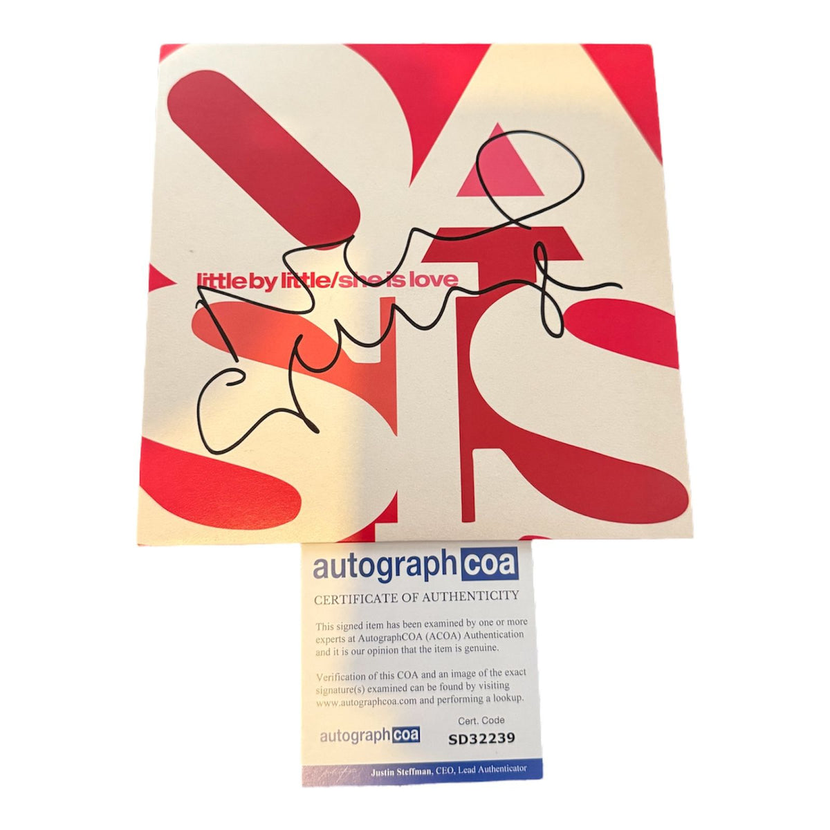 Noel Gallagher signed Oasis Little By Little vinyl record sleeve featuring an authentic autograph and Certificate of Authenticity.