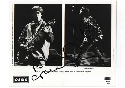 Authentic promotional poster card hand-signed by Noel and Liam Gallagher of Oasis.