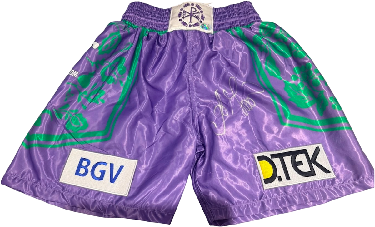 Oleksandr Usyk hand signed boxing shorts in a striking purple and green colour scheme with a bold silver autograph.